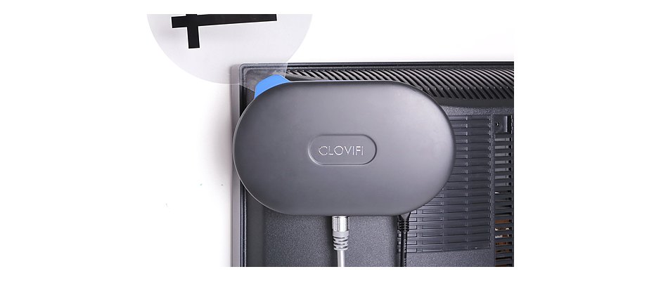 The real CloviFi transmitter mounted on the back of a TV — the actual product in use.